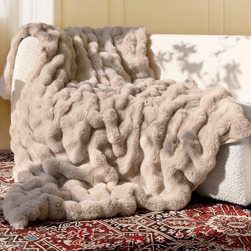 Alt Text for image 1: Ultra Soft Cozy Faux Fur Throw Blanket draped over a sofa, showcasing its luxurious texture in a light brown shade.